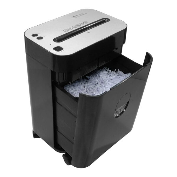 A black and silver Royal PX1201 paper shredder with a drawer full of shredded paper.
