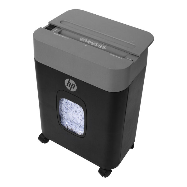 A black and grey HP paper shredder with a window showing shredded paper.