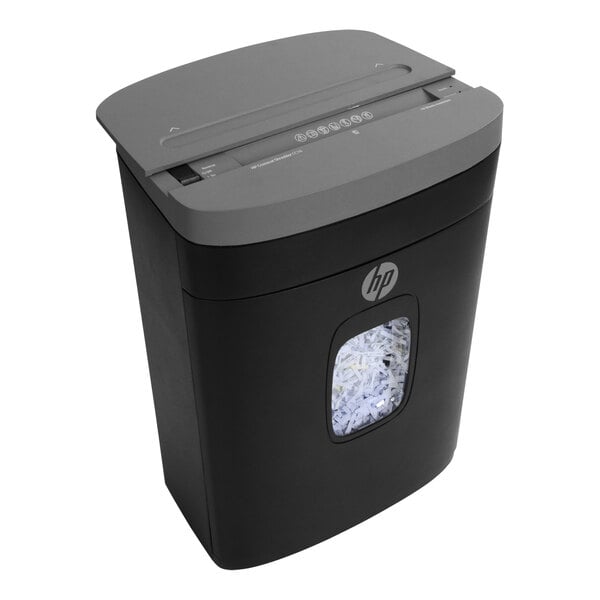 A black and grey HP paper shredder with a window showing paper inside.