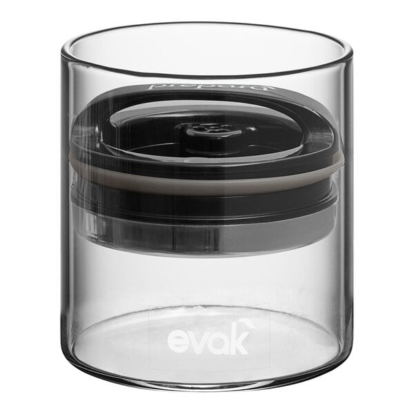 A clear glass container with a black lid.