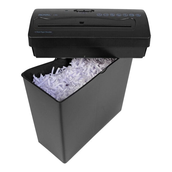 Shredded paper in a black Royal cross-cut shredder with the lid open.