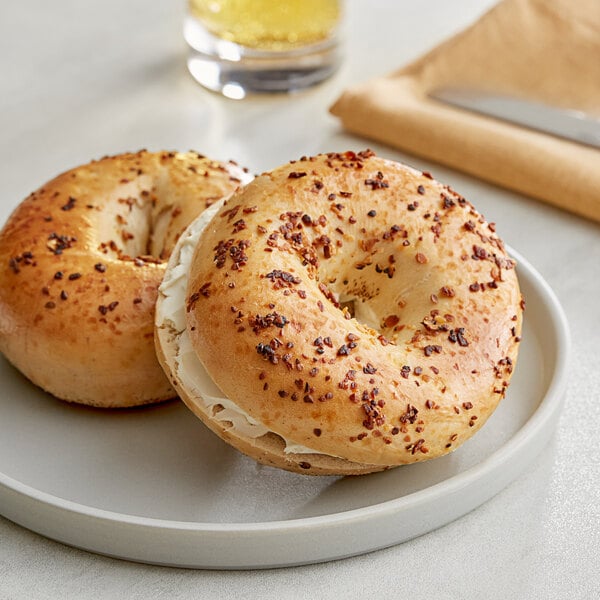 A bagel on a plate.