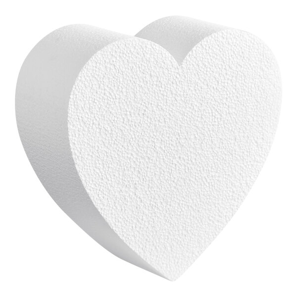A close up of a white Baker's Lane foam heart cake dummy.