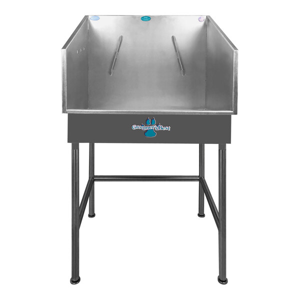A silver rectangular Groomer's Best bathing tub with a center drain.