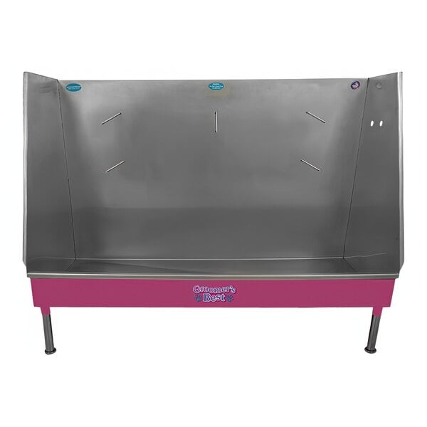 A pink and silver metal Groomer's Best walk-in bathing tub.