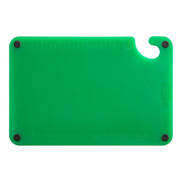 A green Choice plastic cutting board with black grips.