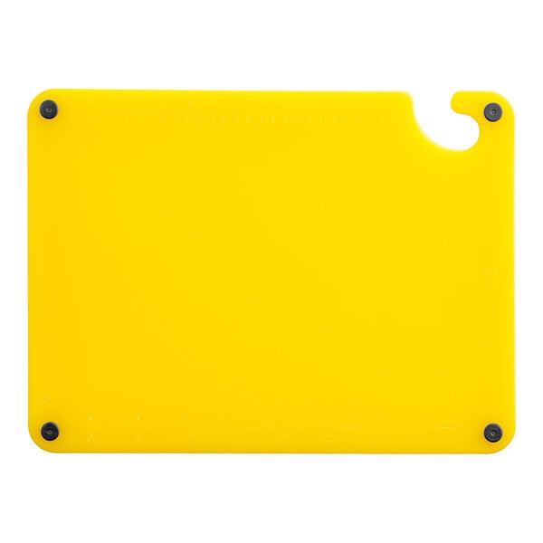 A yellow rectangular Choice cutting board with white lines and black grips.