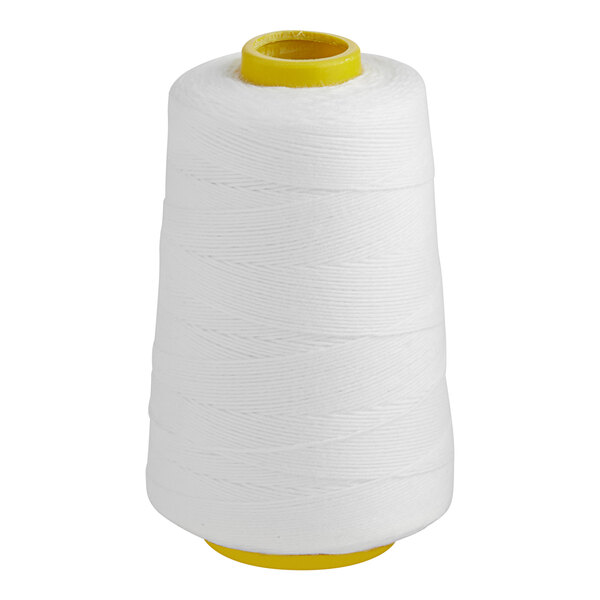 A white spool of cotton thread with a yellow handle.