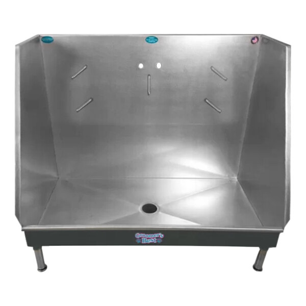 A gray metal Groomer's Best walk-in bathing tub with a center drain.