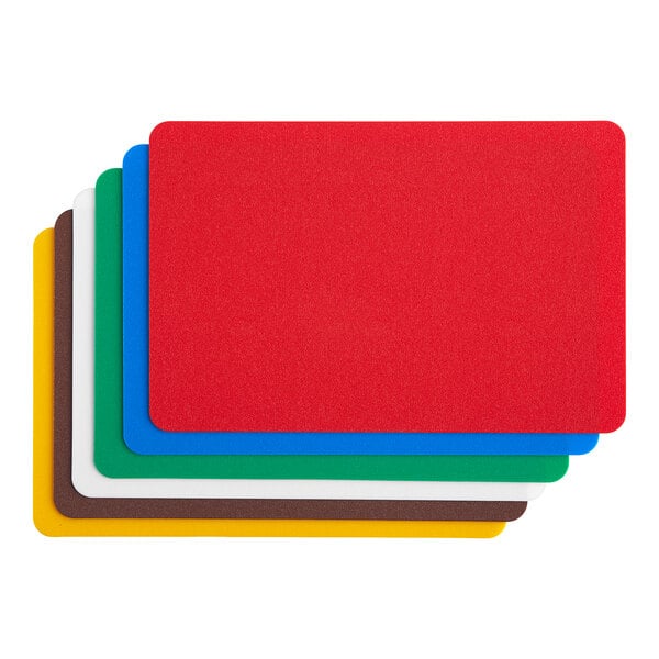 A group of colorful rectangular plastic cutting mats.