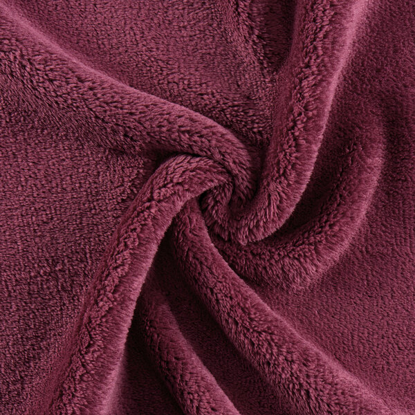 A close up of a burgundy Monarch Brands coral fleece fabric.