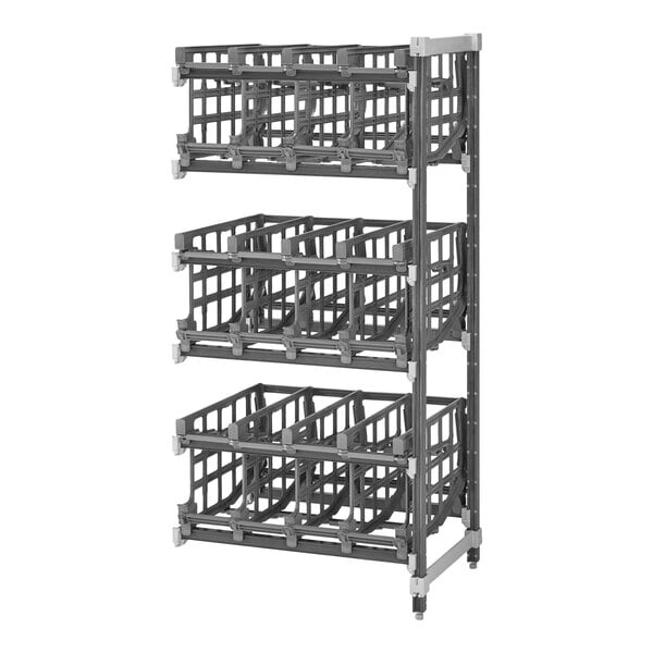 A grey metal Cambro Camshelving® Elements XTRA stationary rack with several bins on it.