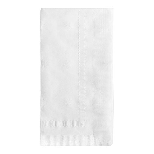 A close-up of a Tork white 1/6 fold dinner napkin.
