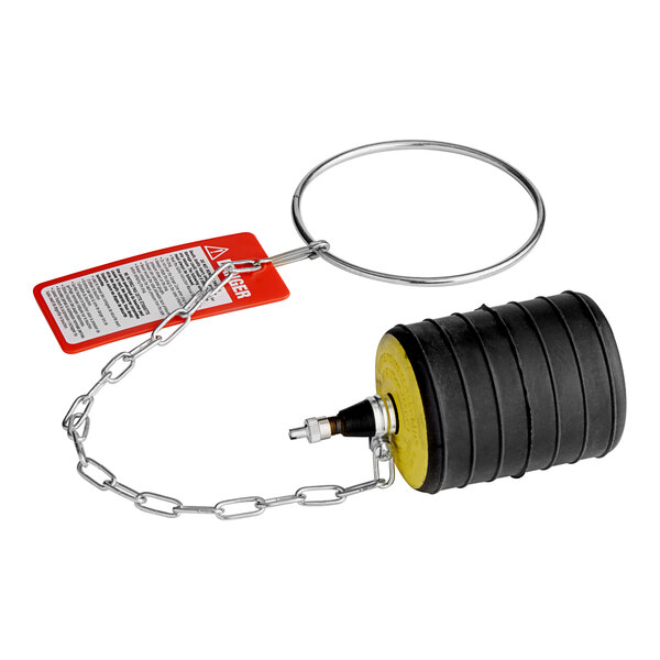 A black and yellow Cherne multi-size test-ball plug with a chain and red tag.