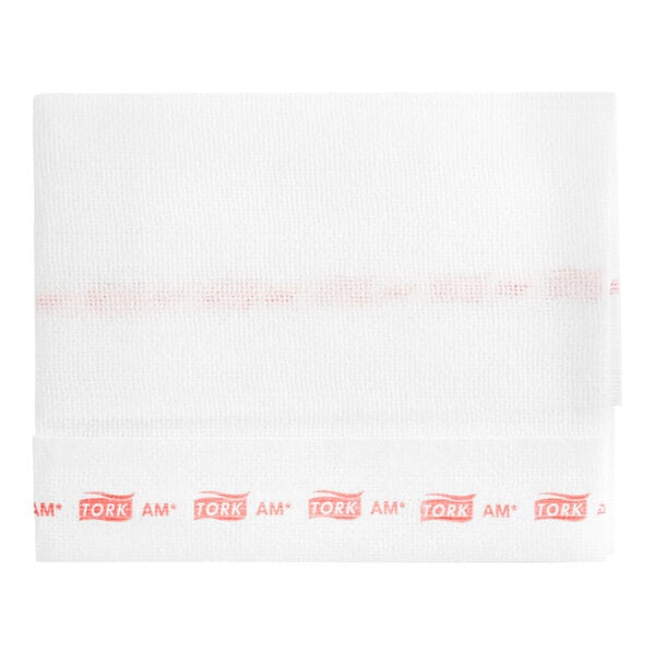 A white Tork fabric towel with red stripes and text reading "Tork Odor-Resistant Food Service Wiper" in red.