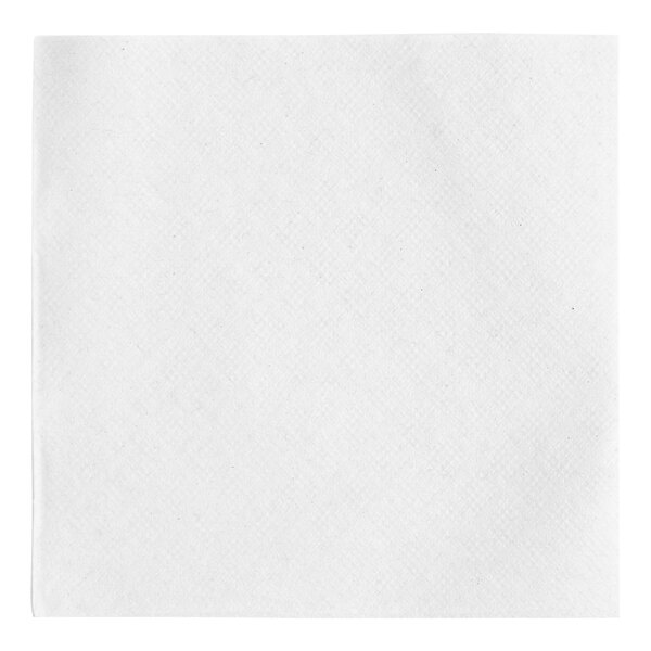 A close-up of a Tork white square beverage napkin.