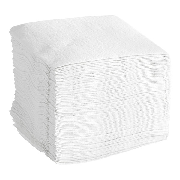 A stack of white Tork paper wipers.