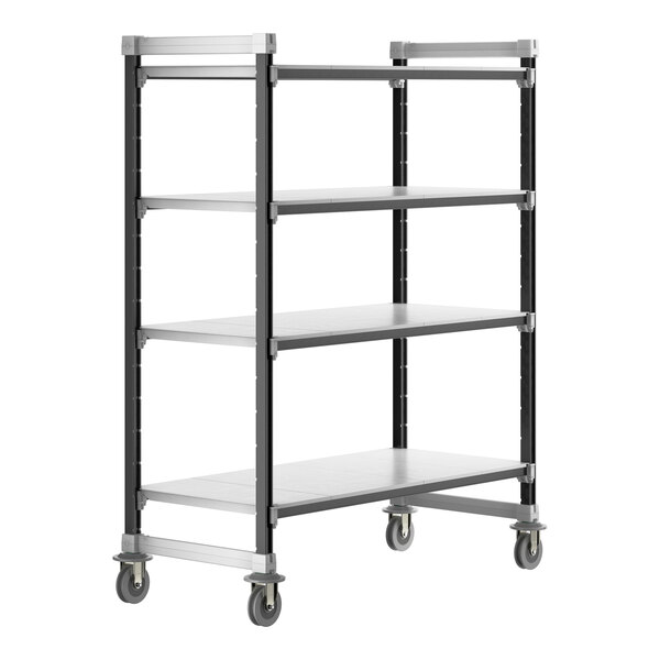 A grey metal Cambro Camshelving unit with wheels and four solid shelves.
