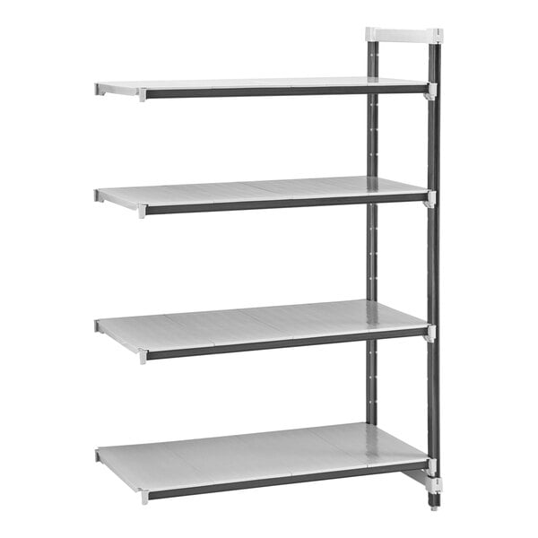 A grey metal shelving unit with four white shelves.