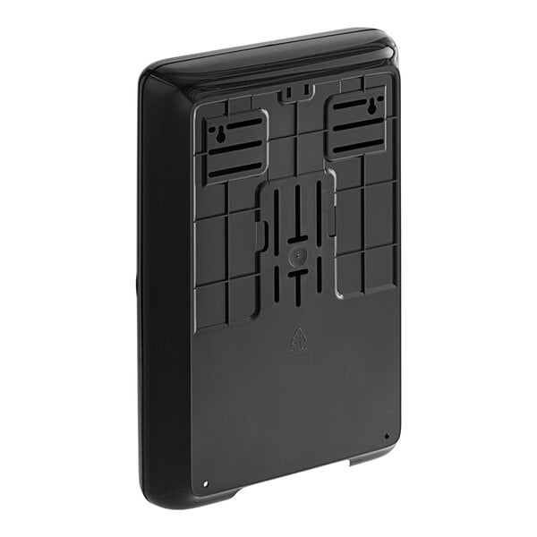 A black rectangular Tork wall mount dispenser with a small compartment on top.