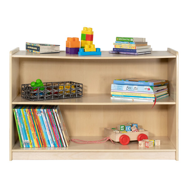 A Flash Furniture wood classroom storage cabinet with books on the shelf.