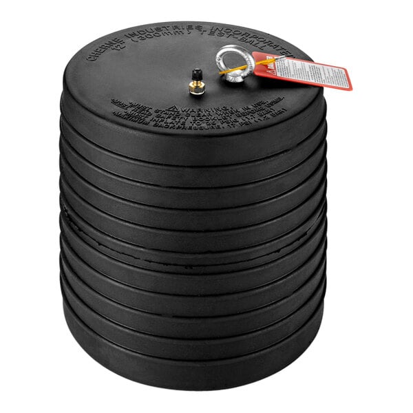 A stack of black round Cherne Test-Ball plugs with a red tag.