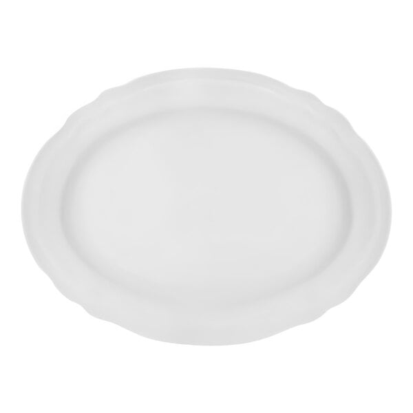 A white porcelain oval platter with a scalloped edge.