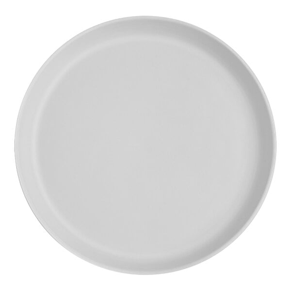 A close-up of a white Santa Anita Reflections stoneware plate with a circle on the rim.