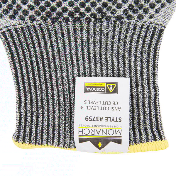 A pair of Cordova Monarch gray work gloves with two-sided nitrile dots.