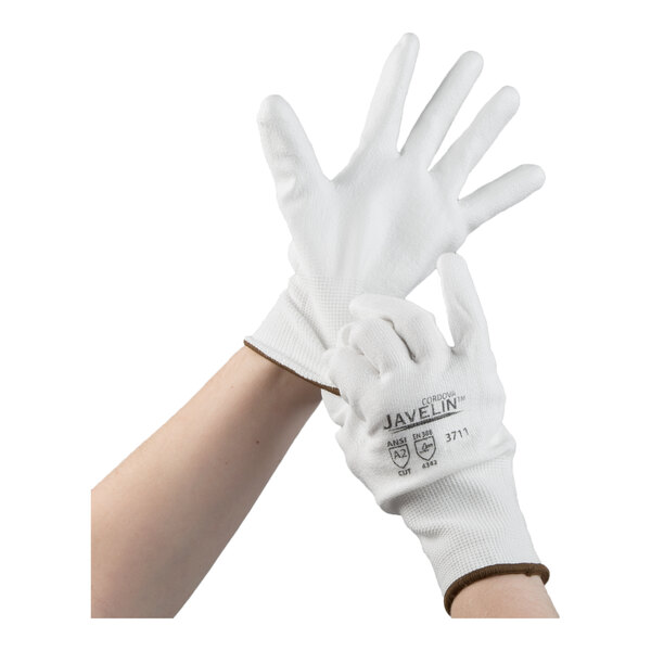 A pair of white Cordova Javelin HPPE and synthetic fiber gloves with a white polyurethane palm coating, shown being worn on hands.
