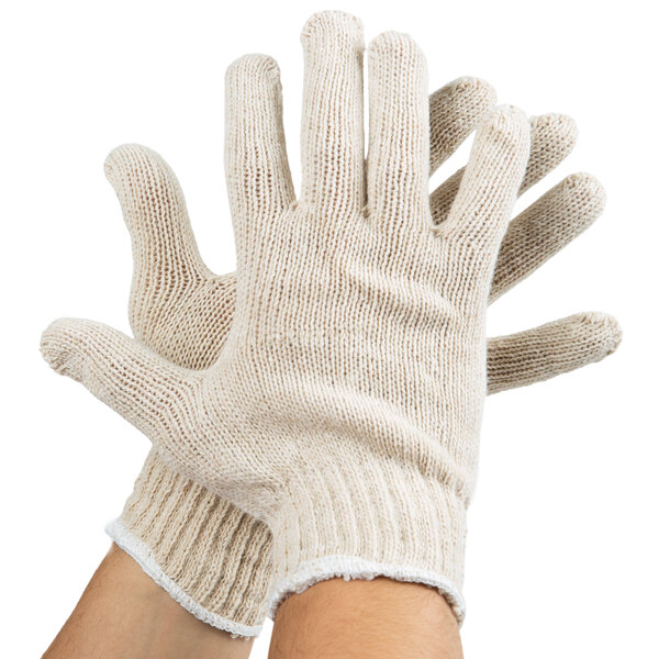 A pair of medium natural polyester and cotton Cordova jersey work gloves with a white knit.