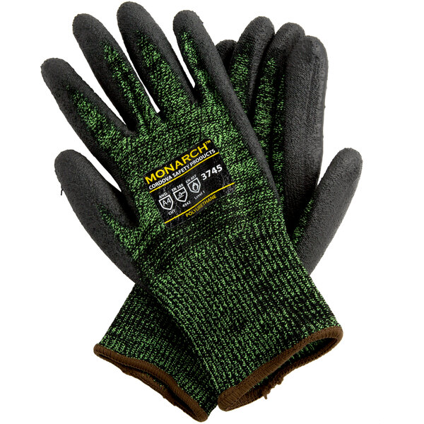 A pair of Cordova Monarch green and black work gloves.