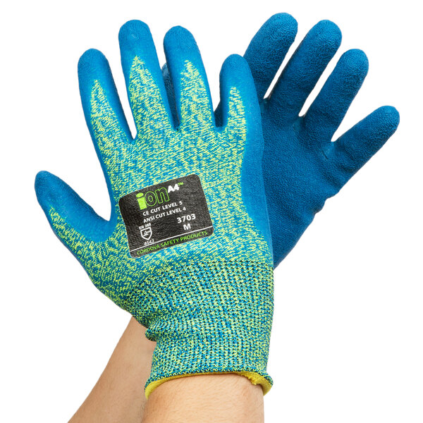 A pair of small blue and yellow Cordova iON A4 cut-resistant gloves with blue crinkle latex palms on a pair of hands.