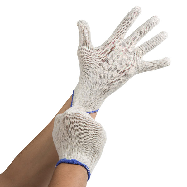 A pair of small Cordova jersey gloves with blue trim on the wrists.
