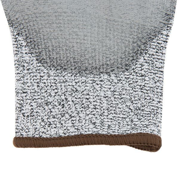 A close up of a Cordova Valor warehouse glove with gray polyurethane palm coating.