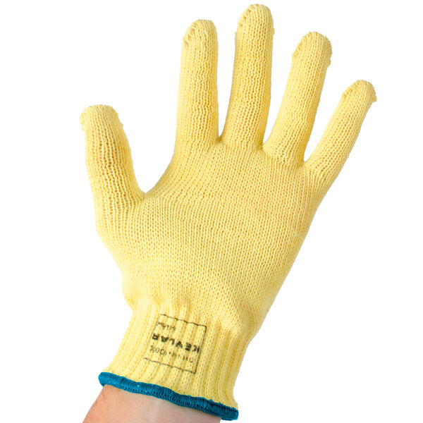 A yellow Cordova cut-resistant glove with a blue wristband.