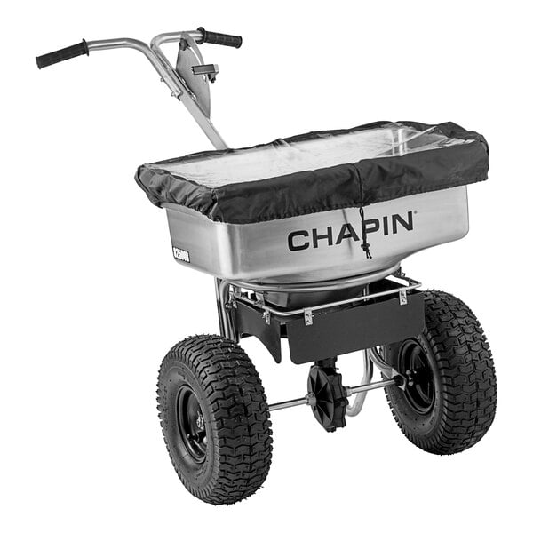 A Chapin stainless steel broadcast salt spreader with a black handle.