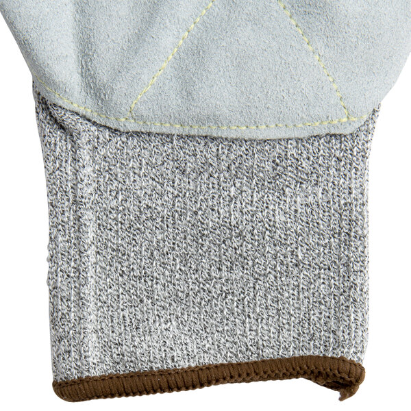 A close up of a pair of gray Cordova Monarch work gloves with split leather palms.