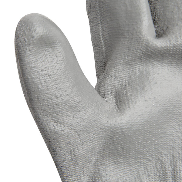 A pair of extra small Cordova gray gloves with gray palm coating.