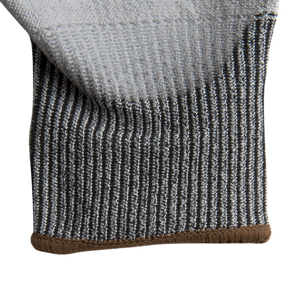 A close up of a gray knit Cordova Monarch glove with gray polyurethane coating on the palm.