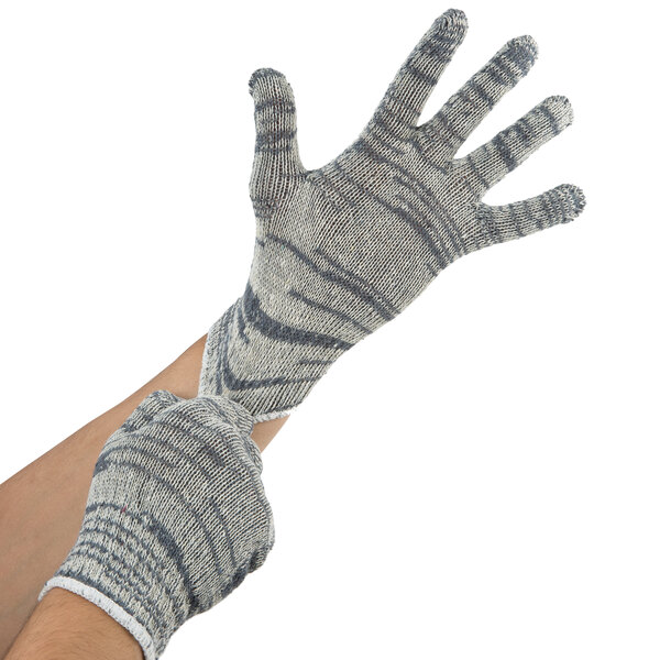 A person wearing Cordova medium weight work gloves with gray and white stripes.