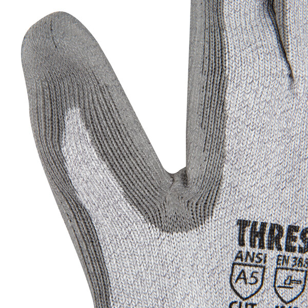 A close-up of a Cordova small cut-resistant glove with gray polyurethane on the palm.