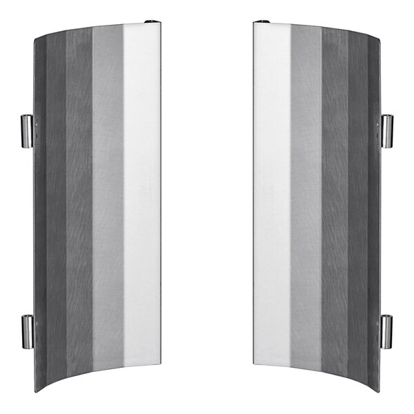 A pair of metal heat shields with black and silver stripes.