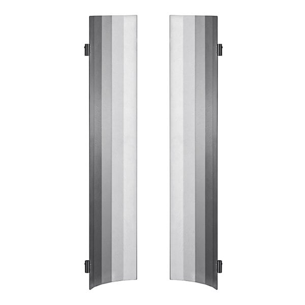 Two metal heat shields with a white rectangular frame.