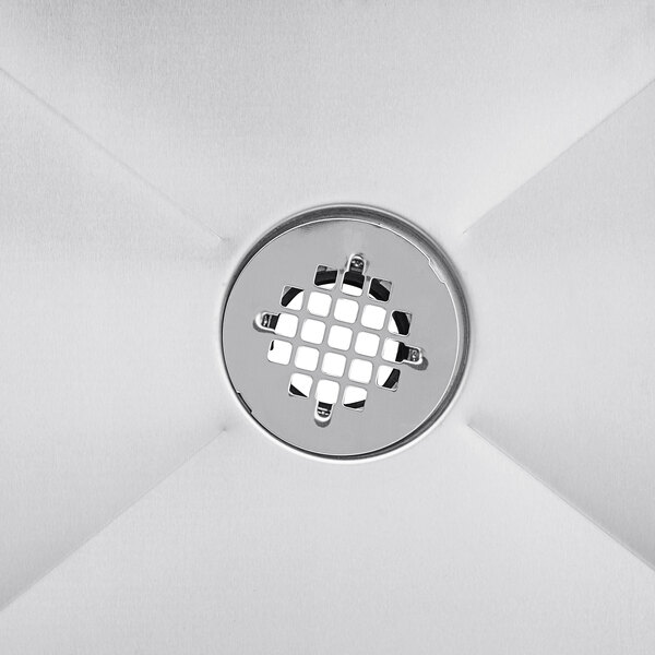 A close-up of the drain on a Steelton stainless steel mop sink.