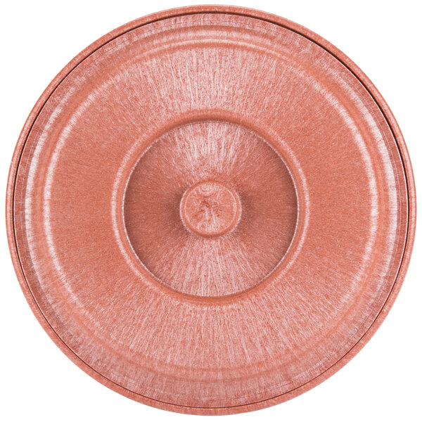 A close-up of a pink, circular HS Inc. Tortilla Server lid.
