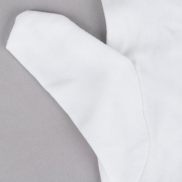 A Cordova white stretch nylon inspector's glove with a small hole in it.