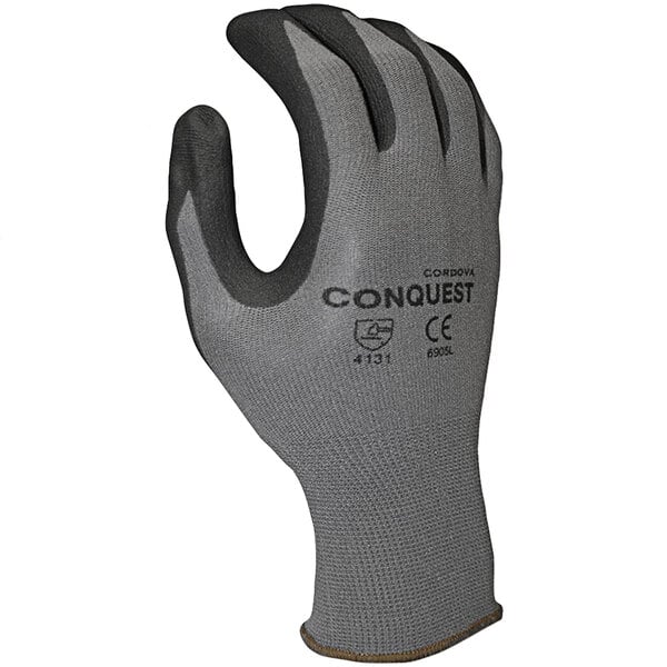 A close-up of a Cordova Conquest gray nylon/spandex glove with black micro-foam nitrile/polyurethane palm coating.