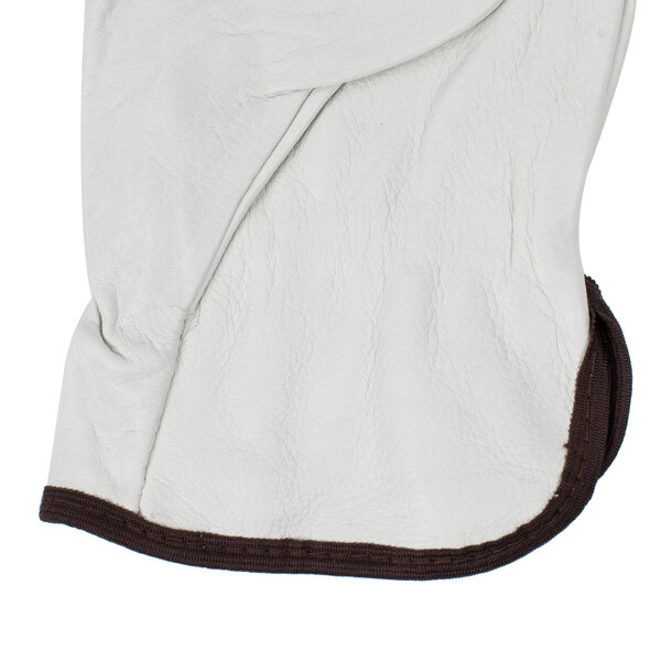 A white leather Cordova warehouse glove with brown trim.