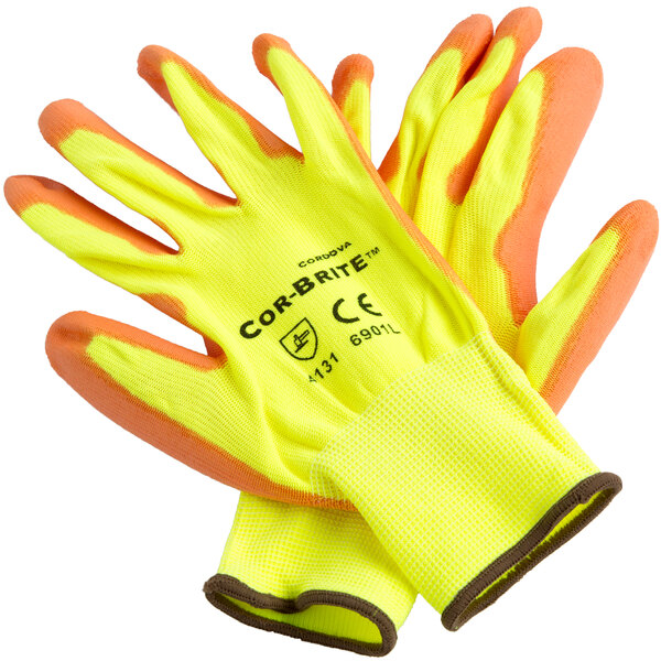 A pair of Cordova yellow gloves with orange palms.